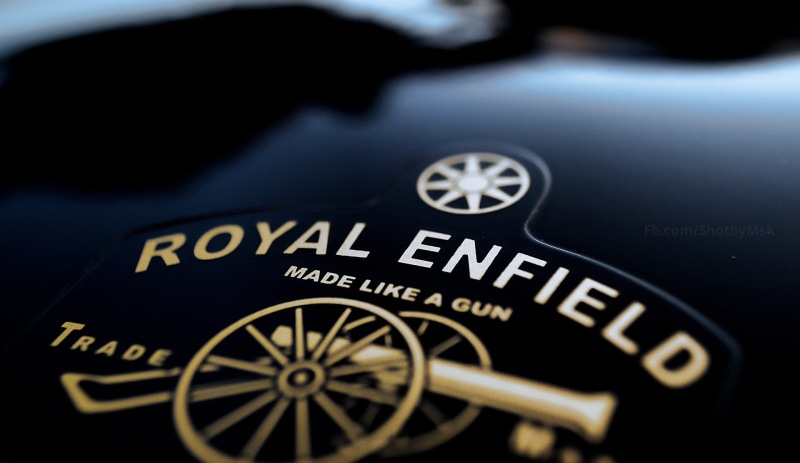 logo, gauge, indoors, motor vehicle, mode of transportation, western script, selective focus, macro, vehicle interior, text, transportation, 1080P, no people