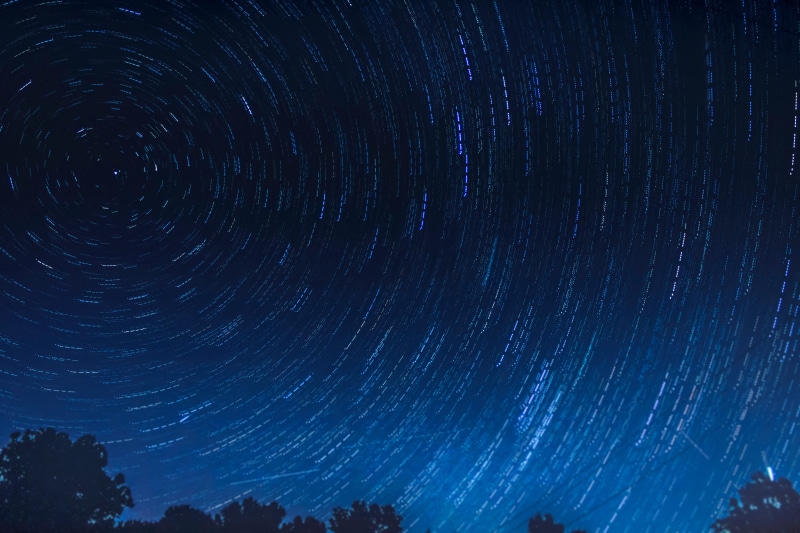 star field, concentric, planet - Space, tranquil scene, space and astronomy, majestic, landscape, blue, sky, low angle view, nature, space, milky Way, star Trail