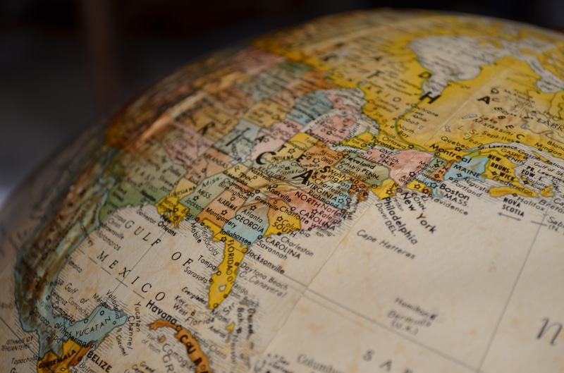 focus on foreground, world map, still life, global, text, maps, 4K, country, western script, direction, communication, physical geography, universe, international