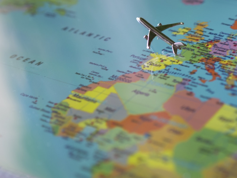 people Traveling, commercial Airplane, western script, communication, globe - Man Made Object, world, continents, guidance, thumbtack, miniature, macro
