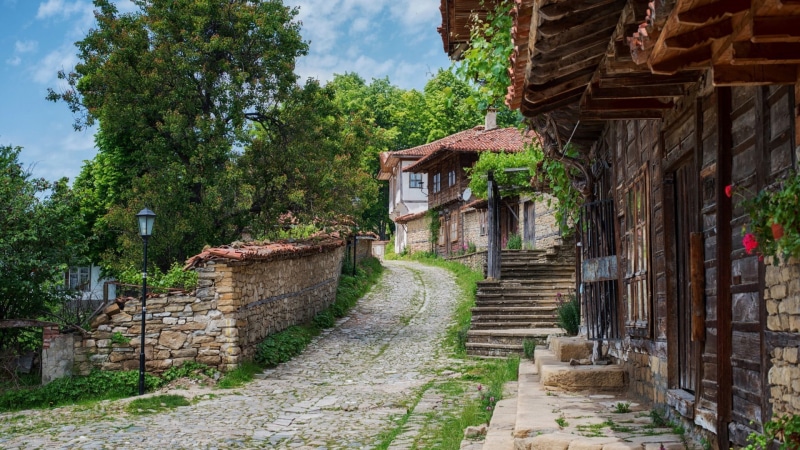 street light, old, stone wall, village, cloud - sky, 1080P, path, outdoors, no people, day, building exterior, stones, stairs, rooftops, sky, brown, trees