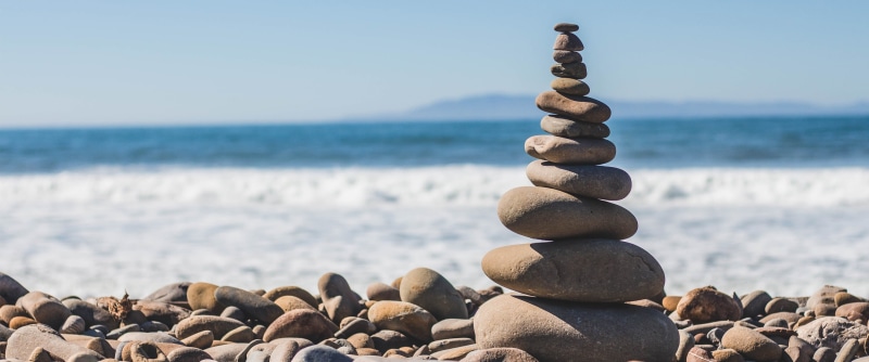 water, land, stone, decor, beach, horizon over water, pebble, ultra-wide, tranquility, rock, stacking, solid, brown, stone - object, nature, large group of objects