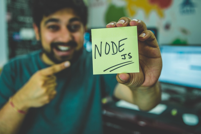 young adult, showing, lifestyles, code, facial hair, programmer, holding, happiness, focus on foreground, developer, indoors, hands, facial expression