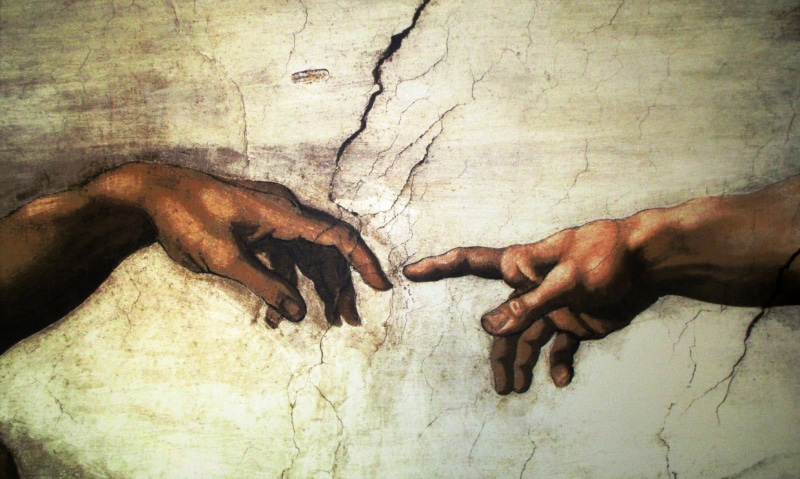 human hand, textured, rome, lifestyles, finger, body part, wall - building feature, thumb, real people, michelangelo, hand, close-up, dirty, outdoors, adam