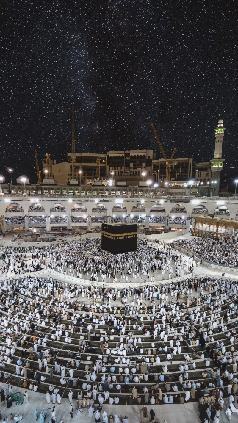 building exterior, cold temperature, grand, urban, crowd, built structure, high angle view, mecca, mosque, snow, sport, architecture, city, kaaba, large group of people