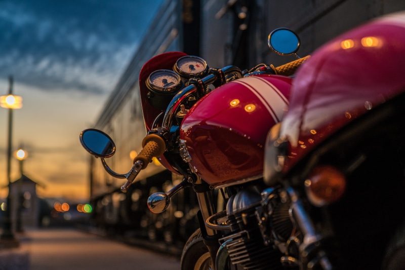 car, transportation, sky, mode of transportation, outdoors, ride, incidental people, red, land Vehicle, motorcycle, city, dusk, selective, motor vehicle