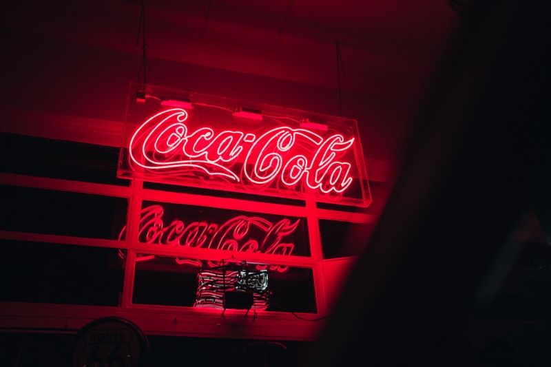 coca, building exterior, low angle view, food and drink, text, western script, led, consumerism, communication, diner, glow, nightlife, no people, built structure