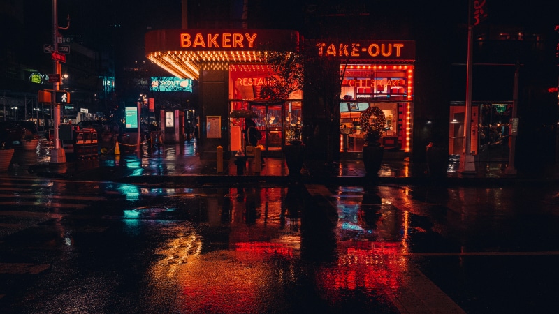 sign, rain, asphalt, night life, city life, built structure, new york, bar counter, communication, light, advertisement, street, meal, illuminated, building exterior