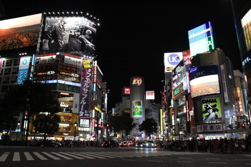 office building exterior, food, zebra crossing, cityscape, 5K, crosswalk, sushi, motor vehicle, night, skyscraper, city street, traffic, buddhism, prefecture