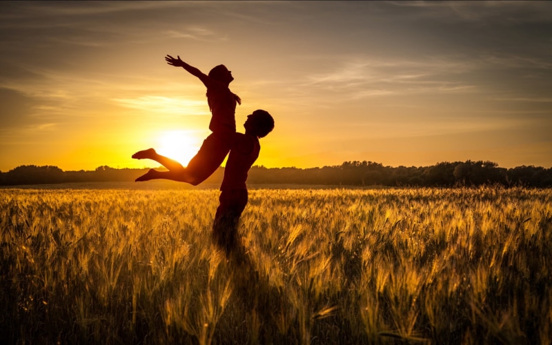 couple, lifestyles, two people, green, women, standing, beauty in nature, arms raised, nature, togetherness, human arm, land, sunset, child, orange color