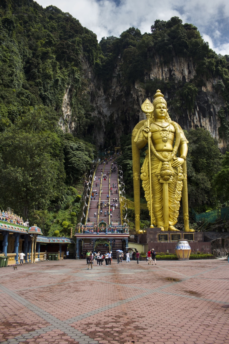 spirituality, architecture, representation, built structure, outdoors, caves, statue, lumpur, hinduism, beside, god, tourism, people, group of people, sculpture