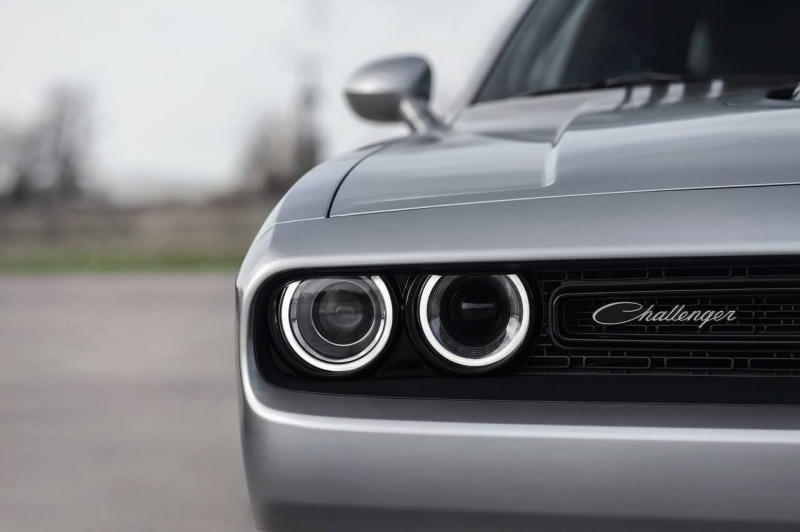 silver - metal, environment, mode of transportation, selective focus, 720P, day, land vehicle, outdoors, Dodge, motor vehicle, black color, wheel, vehicle