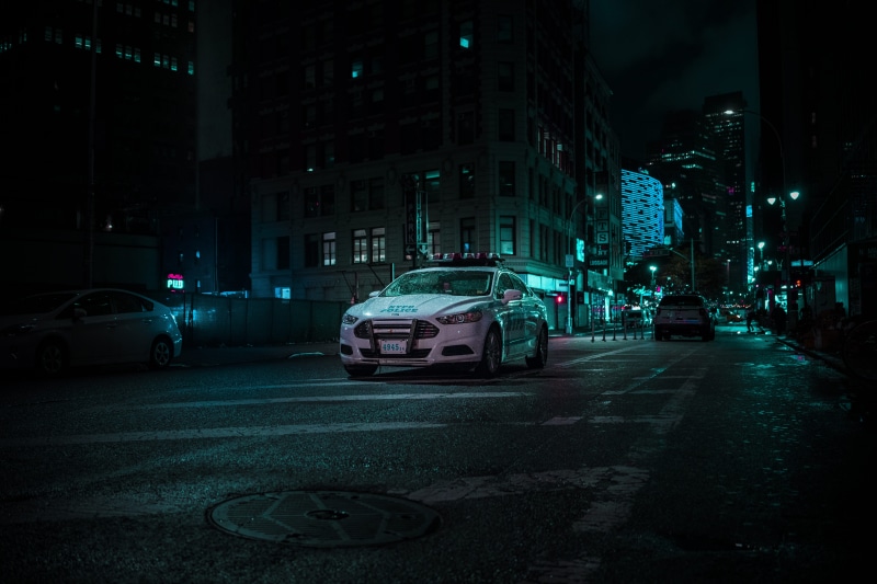 mode of transportation, architecture, city street, car, building, parked, spot, city life, policecar, office building exterior, traffic, nyc, vehicle, land vehicle