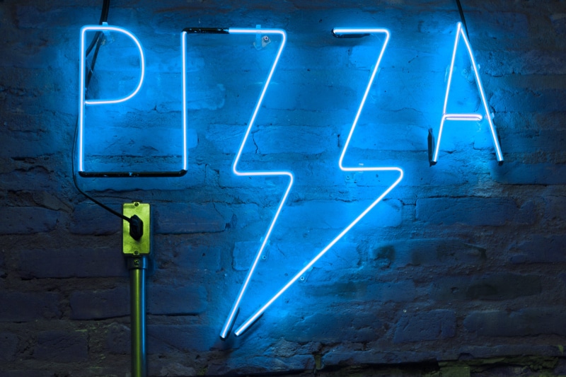 communication, sign, close-up, text, neon, brick, urban, pizza, brick wall, wall, signage, emotion, neon lights, blue, lighting equipment, illuminated