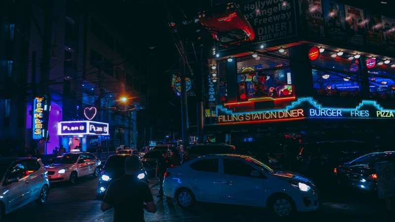 commerce, office building exterior, built structure, land vehicle, communication, city life, car, buildings, city, cityscape, real people, neon, illuminated