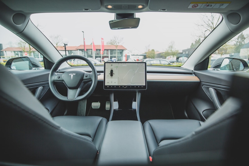 machine, windshield, vehicle seat, cabin, rear-view mirror, tesla, no people, glass - material, tesla model 3, indoors, car seat, electronics, transparent