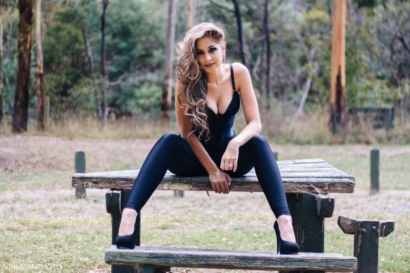 seat, adult, looking at camera, outdoors, wavy hair, Natasha Angeleski, wet clothing, s, hairstyle, beautiful woman, glasses, 720P, real people, full length
