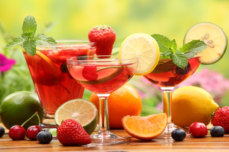 beside, berry fruit, oranges, household equipment, juice, no people, fruit, food and drink, glass, focus, drinking glass, citrus fruit, healthy eating