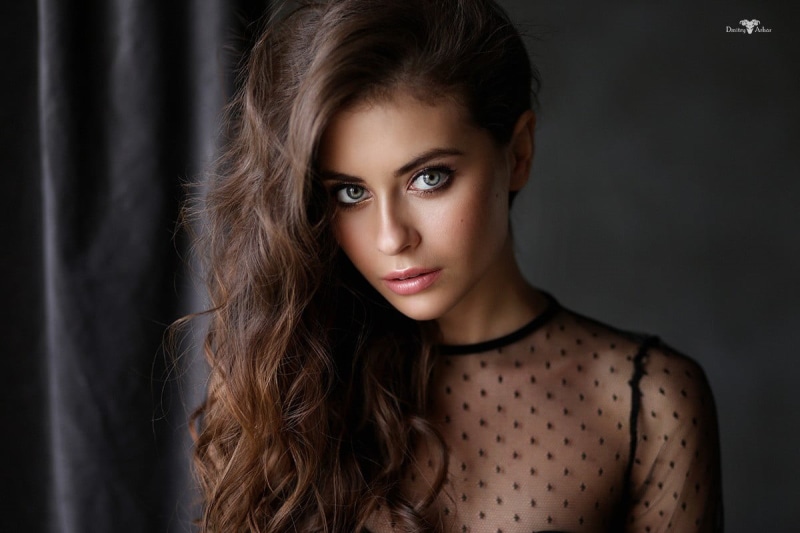 studio shot, illusion, face, 480P, portrait, beauty, fashion, beautiful people, glamour, modern, brown hair, front view, adult, black clothing, hairstyle