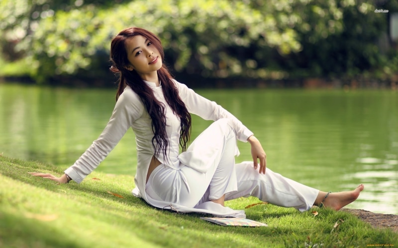 full length, park - Man Made Space, green Color, leisure Activity, forest, meditating, grass, brown Hair, sitting, sleeved, beautiful woman, barefoot, happiness