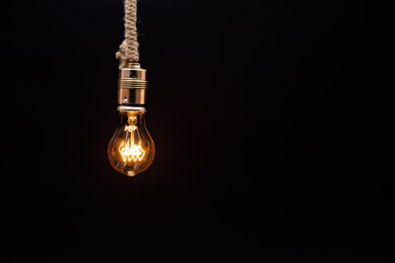 filament, metal, idea, nightlife, lamp holder, black background, single object, fuel and power generation, no people, light - natural phenomenon, copy space