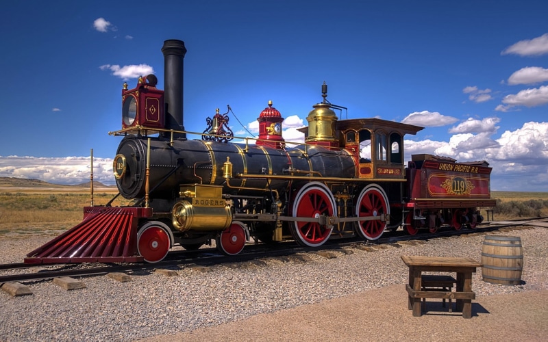 train, history, no people, built structure, blue, architecture, vintage, industry, outdoors, vehicle, steam locomotive, mode of transportation, day, cloud - sky
