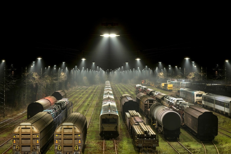 gray, trains, 1080P, in a row, transportation, rail transportation, sky, freight train, skyscraper, no people, train station, trees, glowing, plant, connection