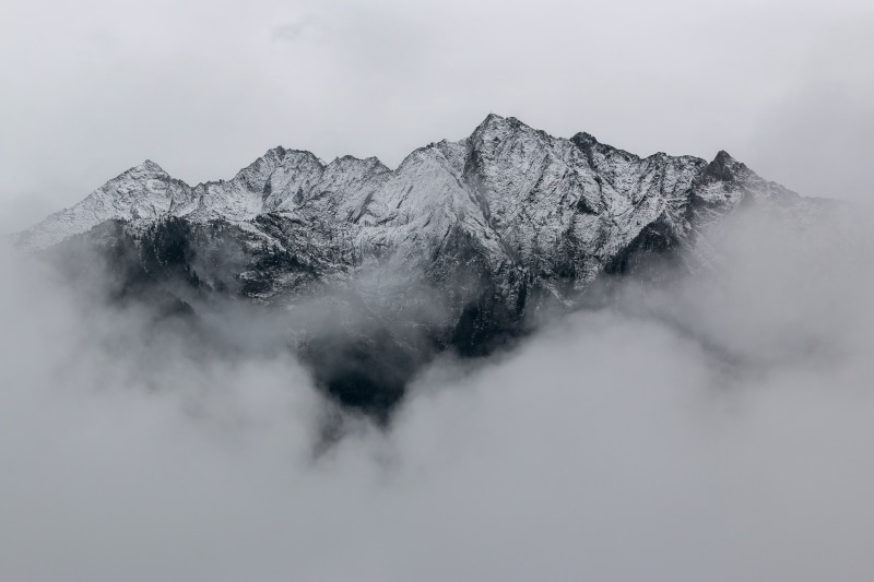 snowcapped mountain, no people, non-urban scene, mountain, mountain top, fog, day, snow, tranquil scene, winter, snowy mountain, cloud - sky, gray, clouds