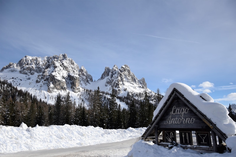 plant, tranquility, mountain range, scenics - nature, sunlight, no people, tree, day, text, beauty in nature, covering, cadini di misurina, white color