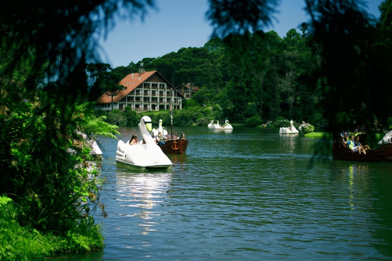 built structure, waterfront, plant, outdoors, water, reflection, building exterior, beauty in nature, nature, lago negro., gramado, tree, architecture