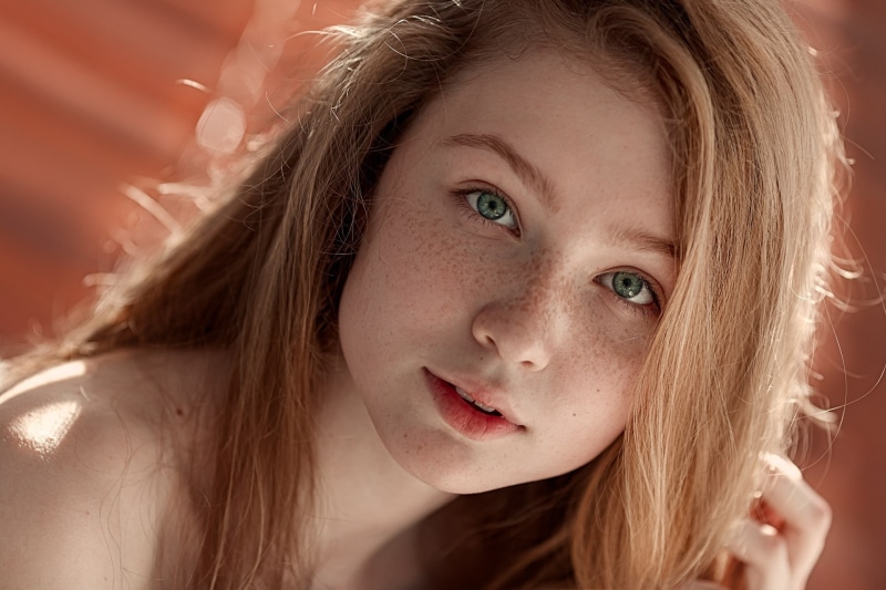 hairstyle, human body part, blonde, young adult, freckles, outdoors, blond hair, one person, 1080P, open mouth, teenager, face, looking at viewer, pale