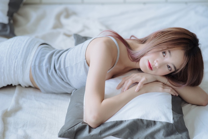 grey tops, women, looking at viewer, short shorts, lying on front, indoors, Asian, in bed, bedroom, model, pillow, women indoors, brunette, 1080P, bed