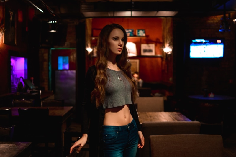 necklace, jeans, belly, bar, 2K, long hair, indoors, grey tops, depth of field, model, brunette, women indoors, crop top, dark, Ksana Stankevich, portrait