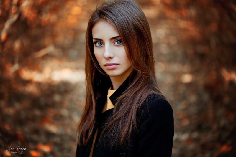 fall, redhead, depth of field, 500px, focus on foreground, coats, women, black, day, beautiful woman, casual clothing, long hair, looking at viewer, one person