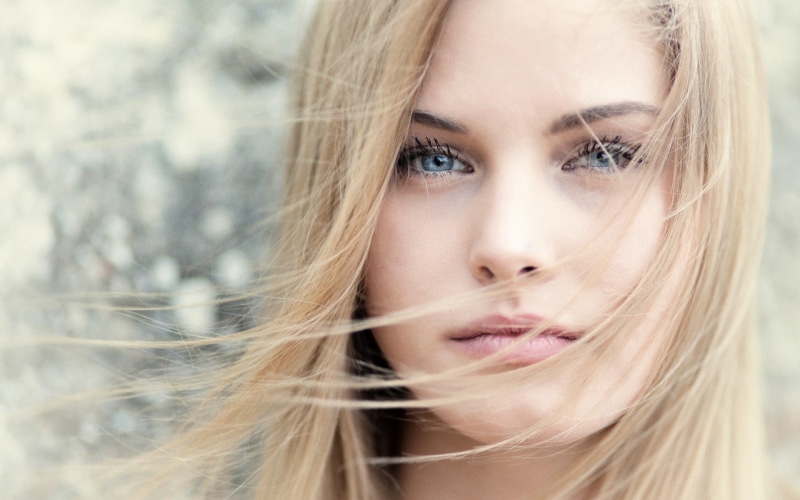one person, 1080P, woman, close-up, beautiful woman, hairstyle, beauty, blond hair, teenager, emotion, looking at camera, headshot, face, human hair, hair in face