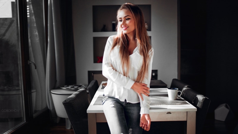s, domestic room, three quarter length, smiling, long hair, beauty, Mary Jane, table, adult, one person, blonde, front view, shirt, real people, white