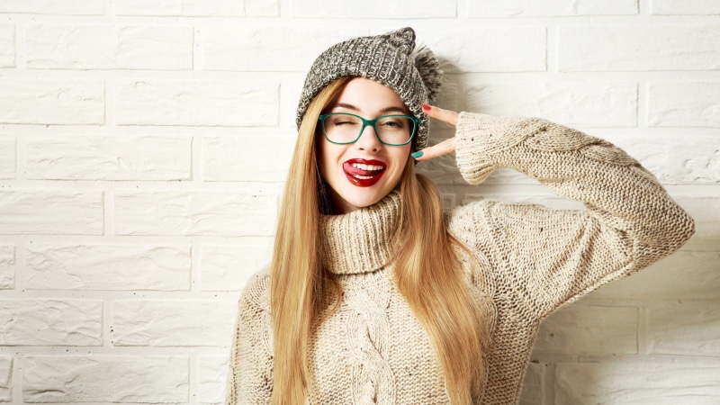 looking at viewer, making a face, one person, beauty, fashion, model, hair, real people, straight hair, sweater, face, clothing, blonde, lifestyles, young adult