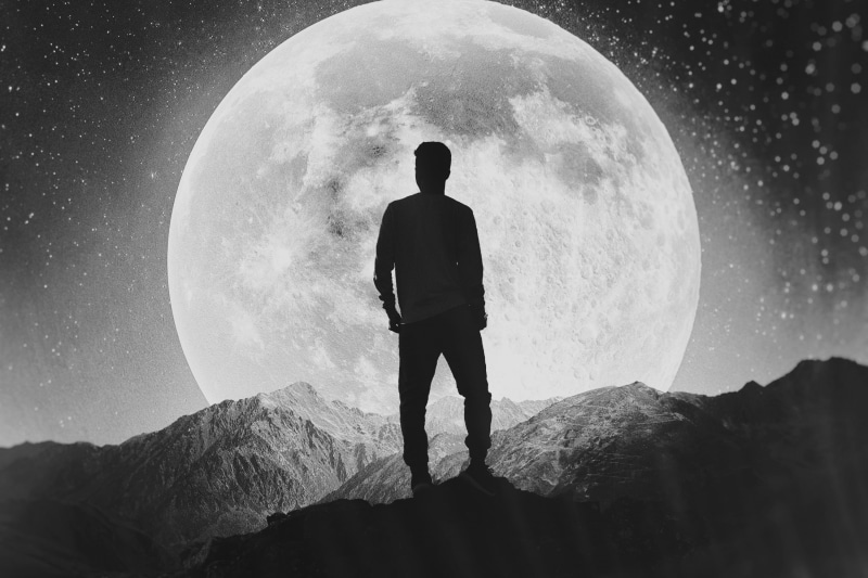 Moon, men, Alone, lifestyles, full length, outdoors, rock - object, Mountains, one person, solid, leisure activity, astronomy, real people, space, mountain peak