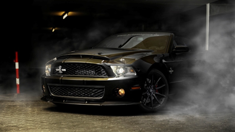 indoors, motor vehicle, car, Ford Mustang Shelby, garage, smoke - physical structure, black, night, lighting equipment, street, black color, land vehicle