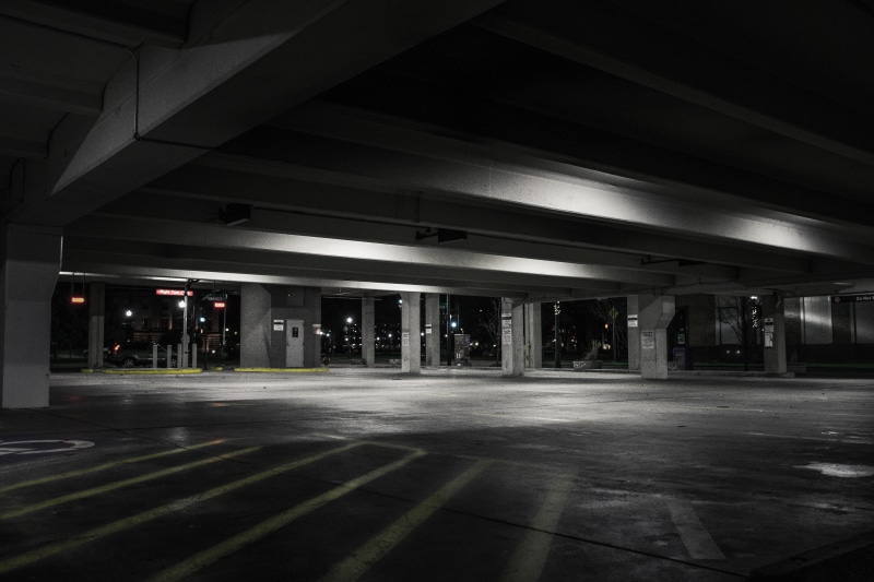 symbol, absence, urban, ceiling, empty, pavement, mode of transportation, parking area, architecture, building, lights, illuminated, parking lot, photography