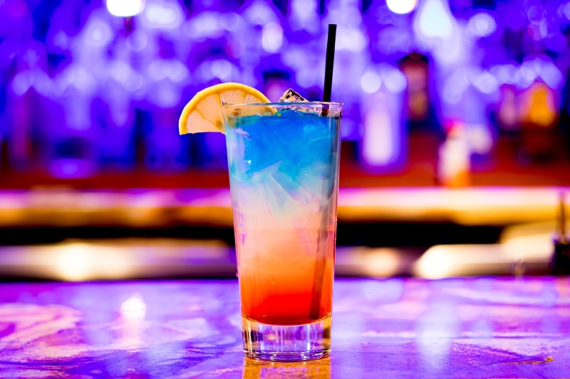 citrus, bartender, colors, purple, household equipment, colorful, drink, lime, cold temperature, beverage, bar, mojito, no people, restaurant, clear, bar counter