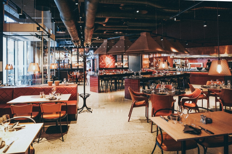 person, cafeteria, human, flooring, interior design, food and drink industry, illuminated, indoors, cafe, wood, arrangement, restaurant, table, empty, food