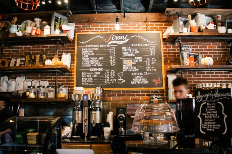 occupation, young adult, shelf, shop, variation, coffee shop, order, small business, standing, business, restaurant, pub, bar - drink establishment, barista