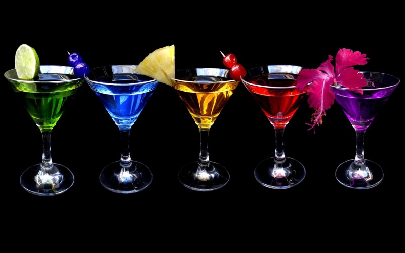 martini glass, indoors, glass, cocktails, nightlife, household equipment, food, five, red, cocktail, group of objects, black background, colorful, martini