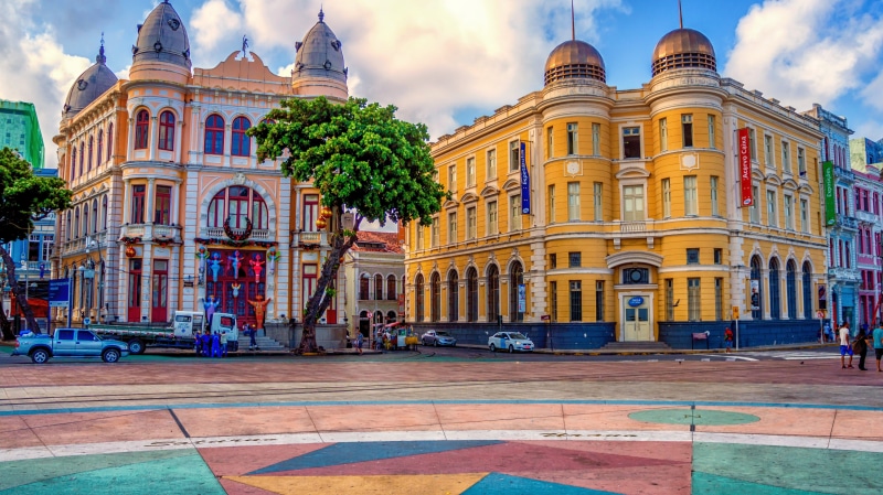 outdoors, yellow, incidental people, marco, building exterior, city, history, buildings, center, zero, brazil, holidays, ancient reef, car, building, summer