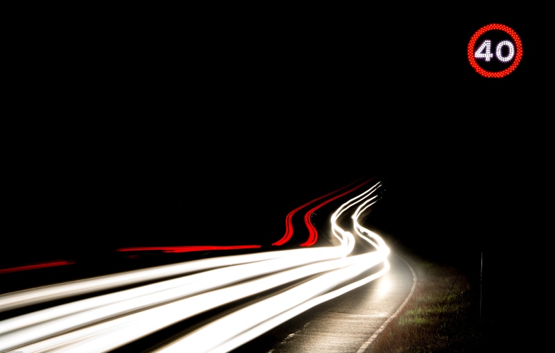 sign, night, track, car light, street, copy space, outdoors, clock, transportation, red, nighttime, streaks, light - Natural Phenomenon, black background