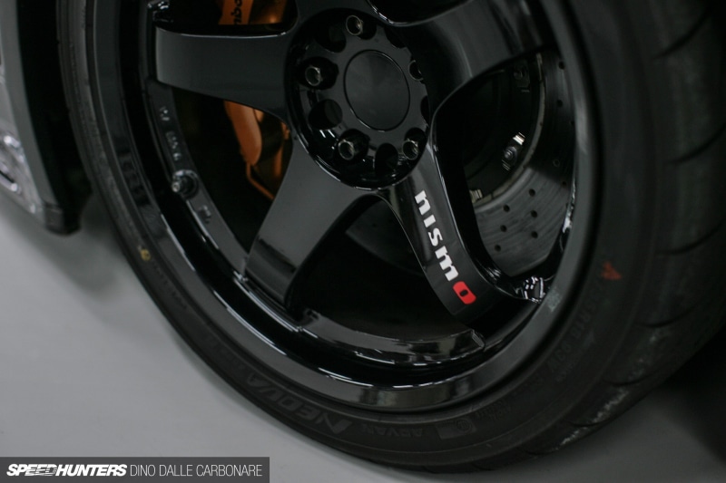 Nissan Skyline GT-R R34 Nismo, motor vehicle, transportation, vehicle part, single object, 1080P, no people, tire, Skyline R34, Speedhunters, modern, equipment