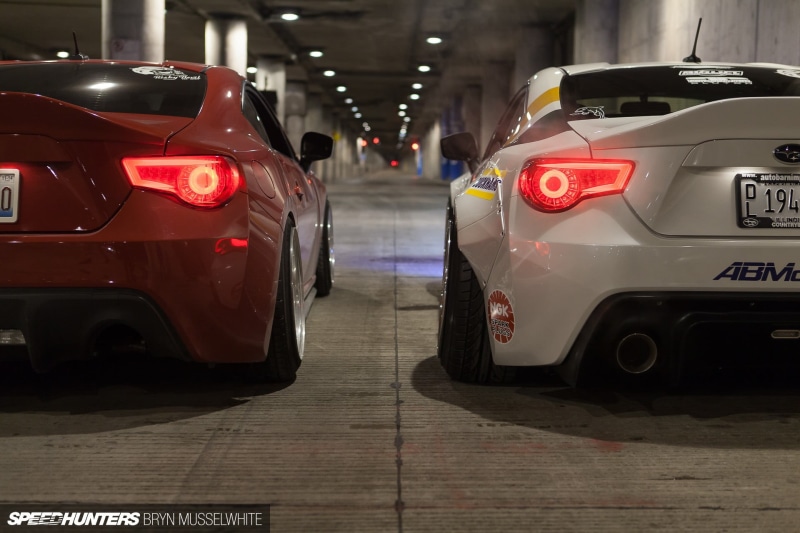 JDM, Subaru, stationary, sign, city, street, focus on foreground, cars, parking lot, motor vehicle, car, red, tail light, silver, transportation, mode of transportation