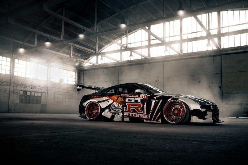 land vehicle, built structure, indoors, motor vehicle, gt, abandoned, stationary, Super Car , car, mode of transportation, transportation, illuminated