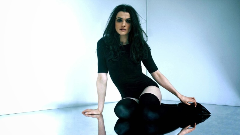 actress, front view, 1080P, bodysuit, long hair, wearing, lifestyles, high, indoors, women, hairstyle, sitting, one person, black color, celebrity, pair
